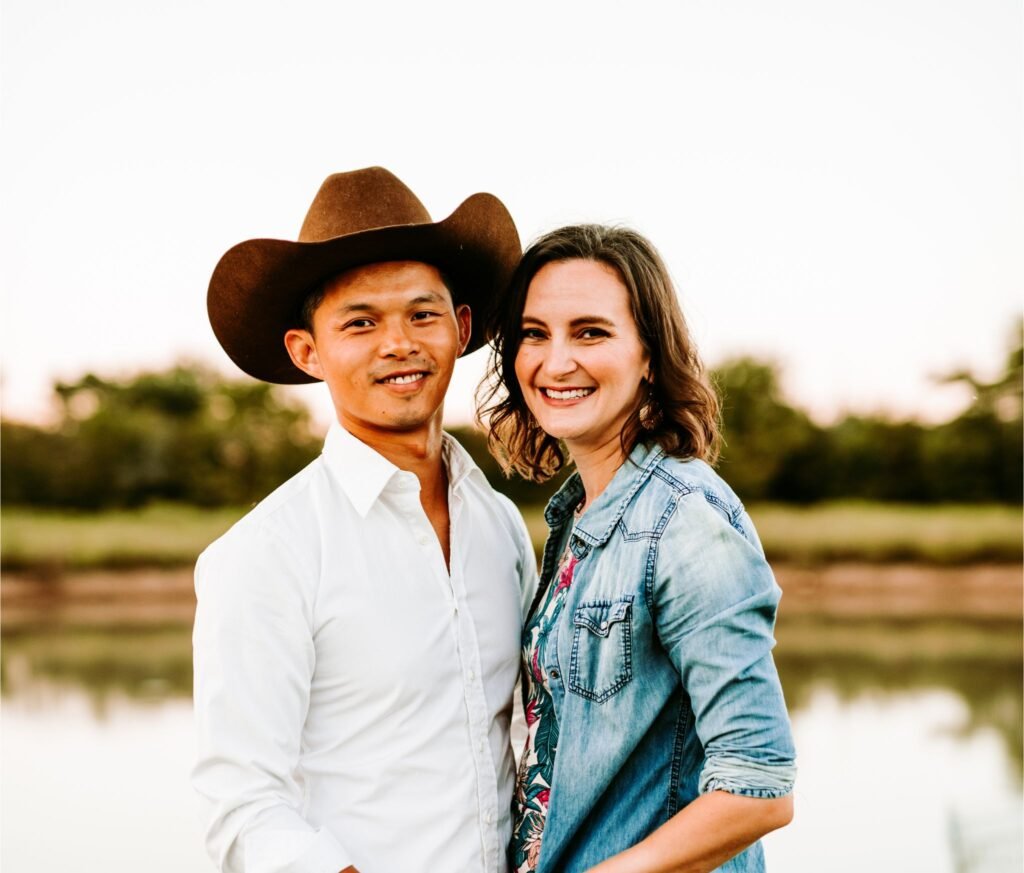 Photo of a man and woman in front of a pond