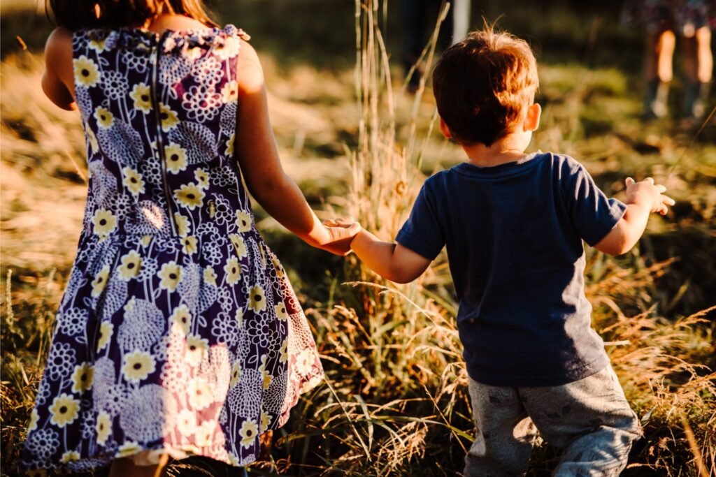 Kids holding hands walking forward